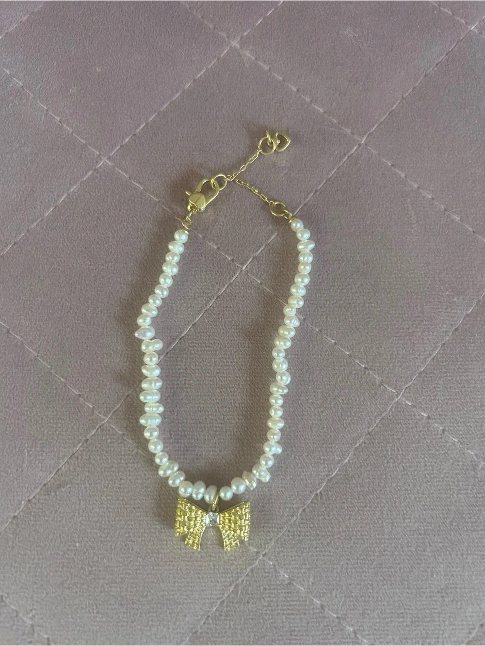 Kate Spade gold bow and pearl bracelet